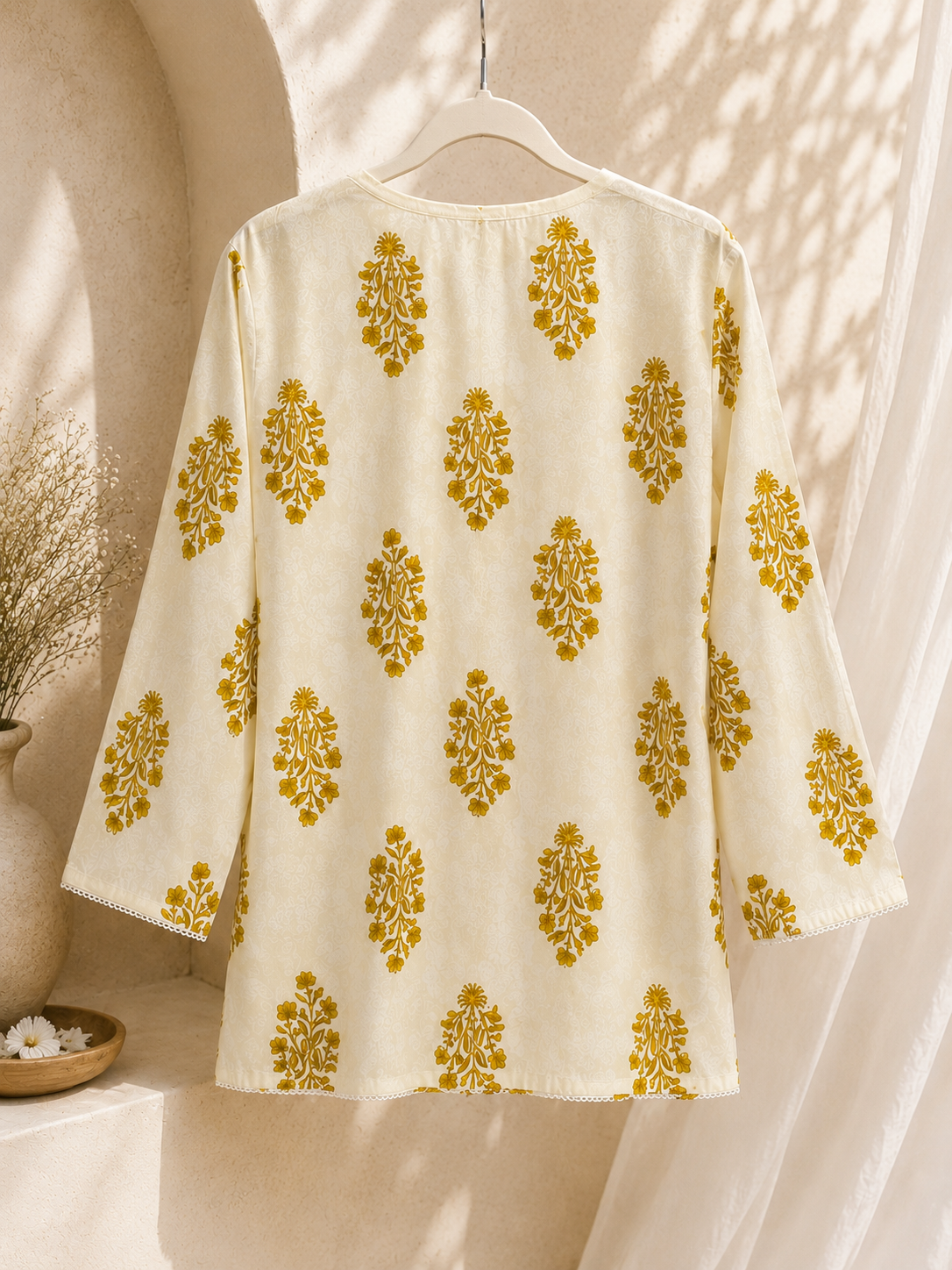 Back view of ivory mustard floral printed women's kurti