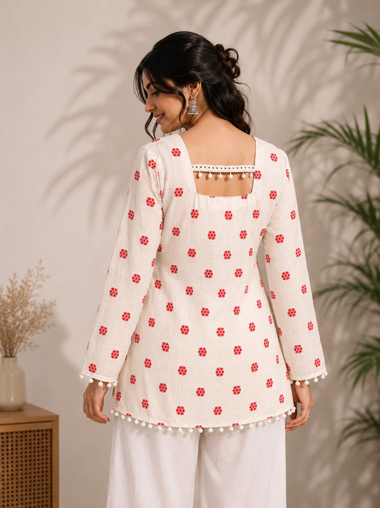 Back view of ivory floral kurta with red floral motifs and decorative neckline detailing