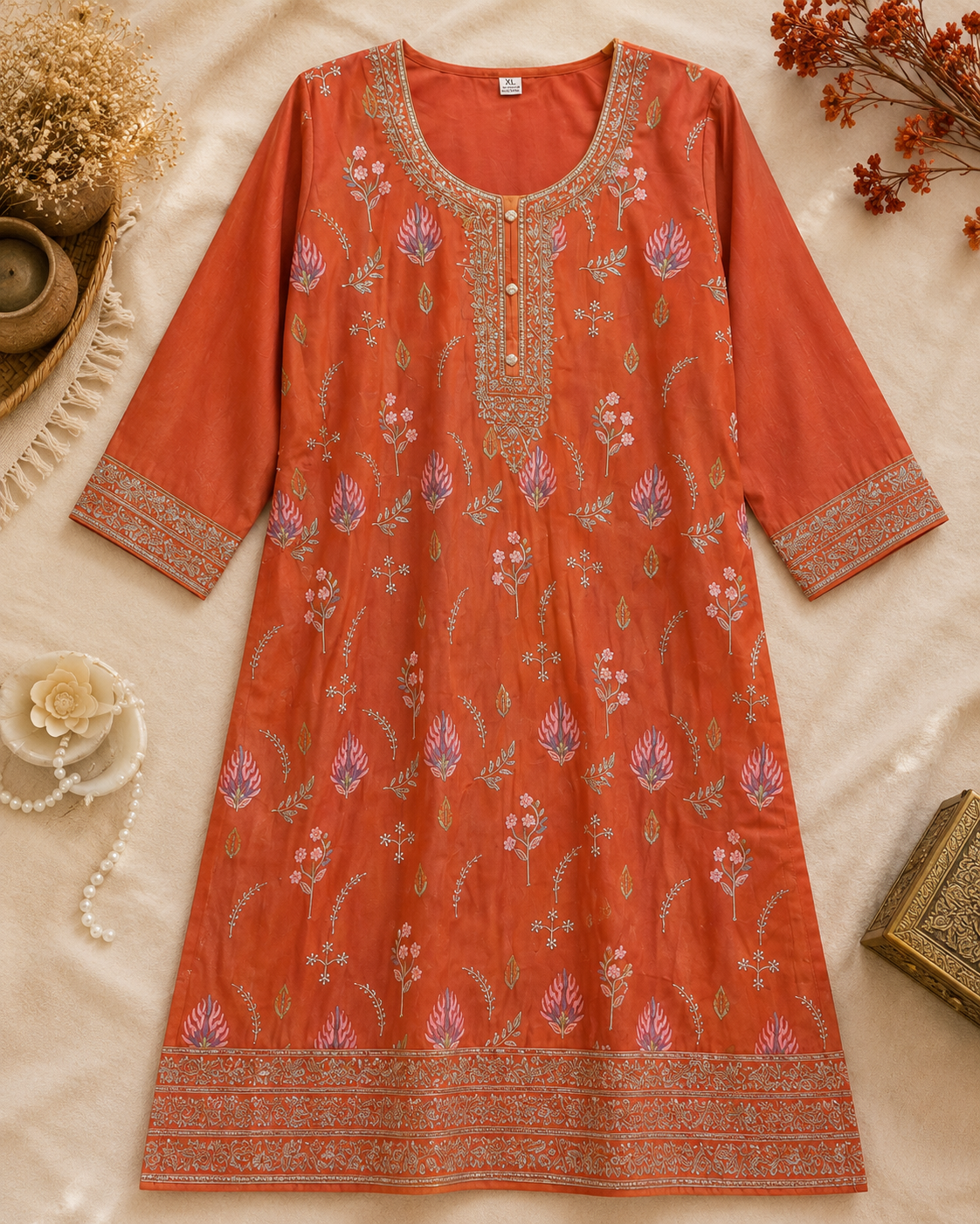 Rust orange floral embroidered kurta with detailed neckline cuffs and hem