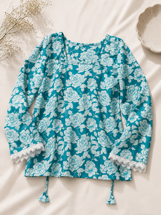 Azure blue floral printed kurti front flatlay with lace sleeve detailing