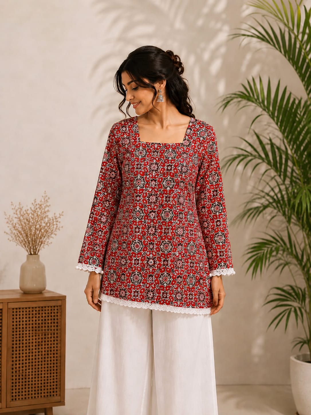 Front view of red printed kurta set with white palazzo for women