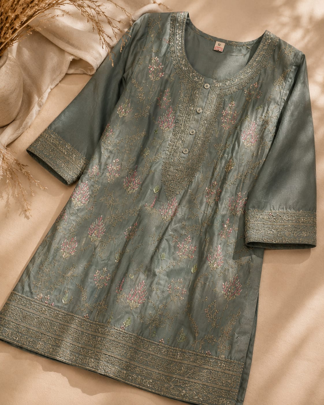 Sage green embroidered kurta with floral embroidery and detailed neckline